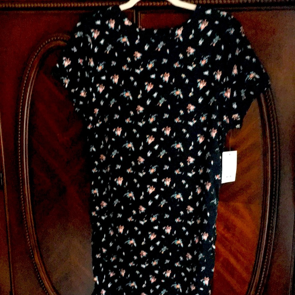 Long black dress with spring flowers short sleeves just below the knees.